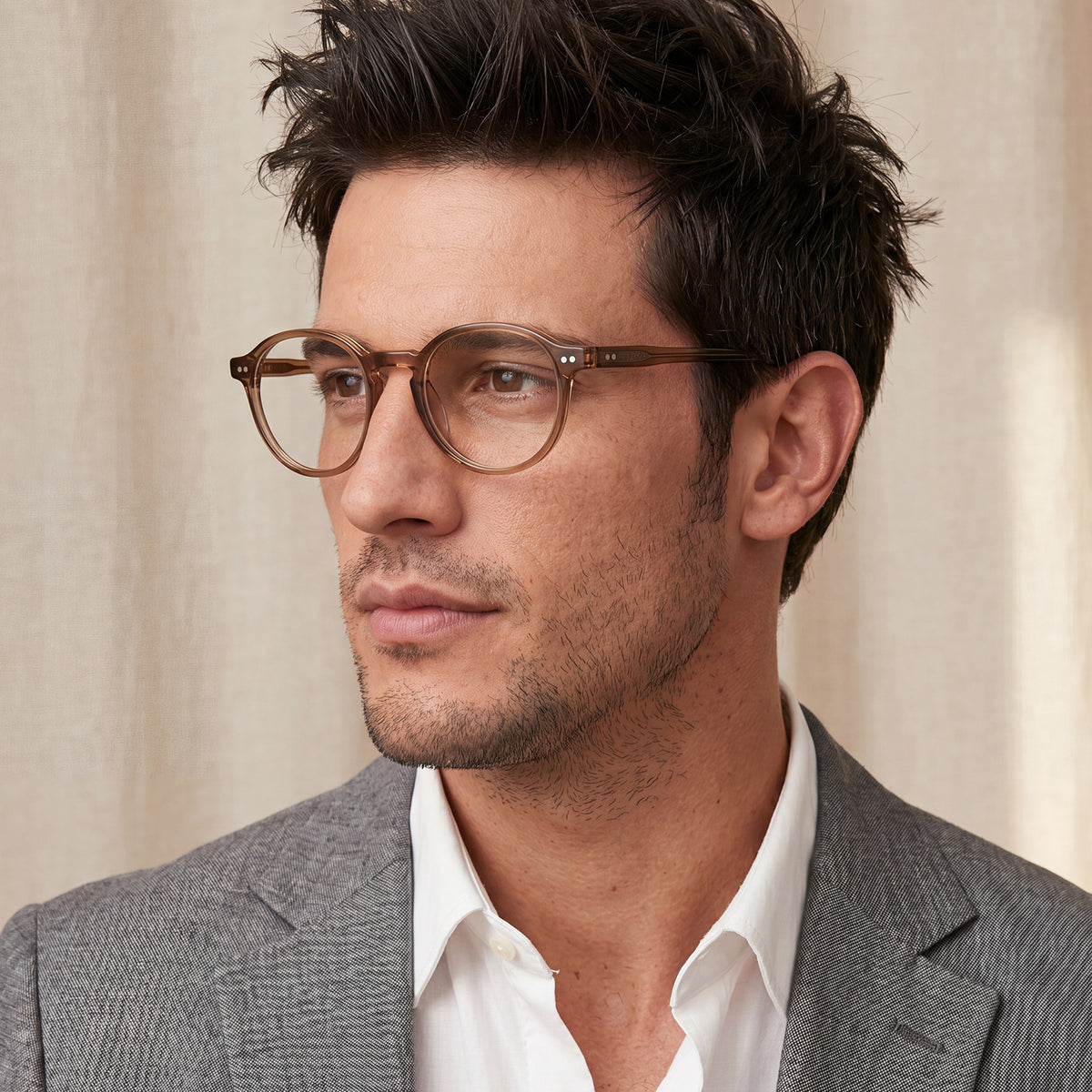 Man wearing glasses and a gray suit CARFIA Finco FC04 – Classic Round Acetate Eyeglasses in Brown